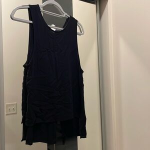 Black flowy shirt open in back. Size S.